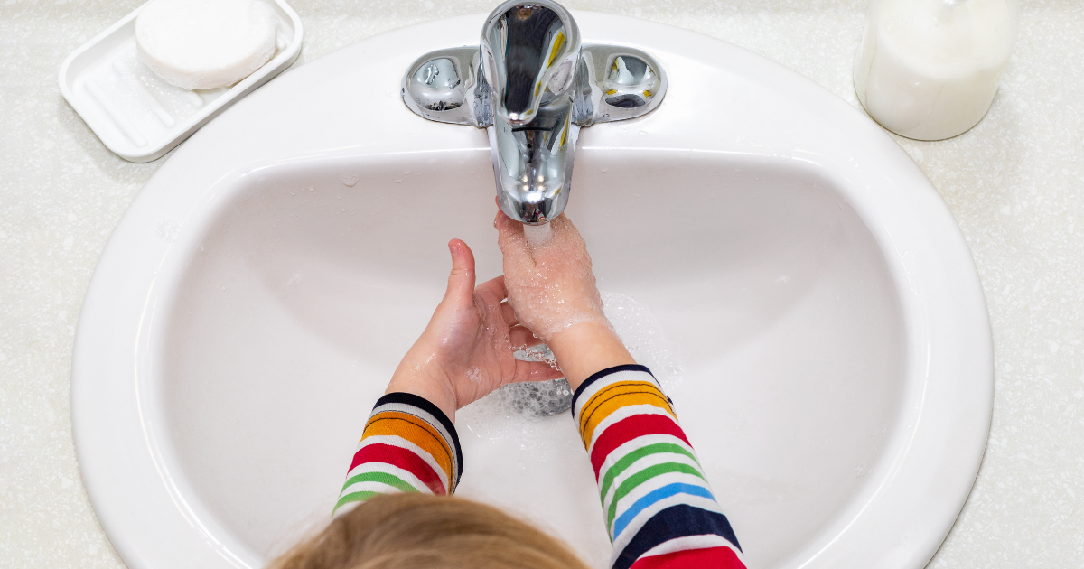 Can I Install My Own Whole House Water Filtration System? - child washing hands at sink