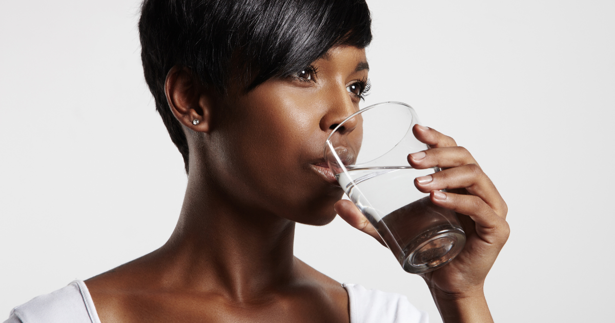 Is Sacramento Drinking Water Safe? black woman drinking a glass of water